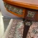 Louis XVI style oval dining table with rosewood marquetry extension mounted in bronze