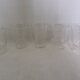 Old digestif or liqueur glasses, handcrafted glass with a floral pattern.