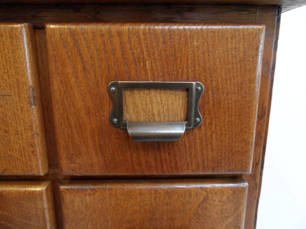 Antique oak apothecary cabinet with drawers