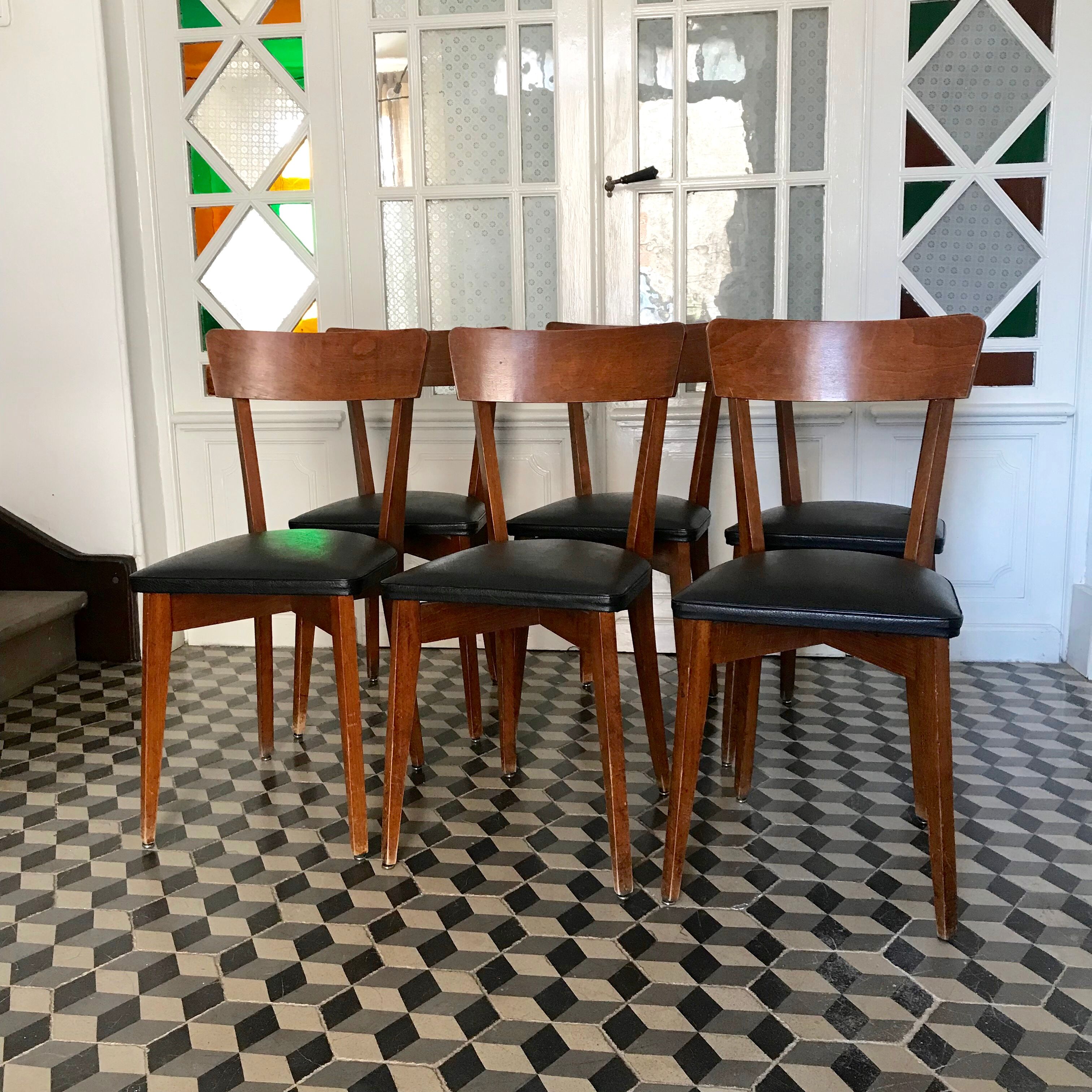 Vintage wooden and black skai chairs