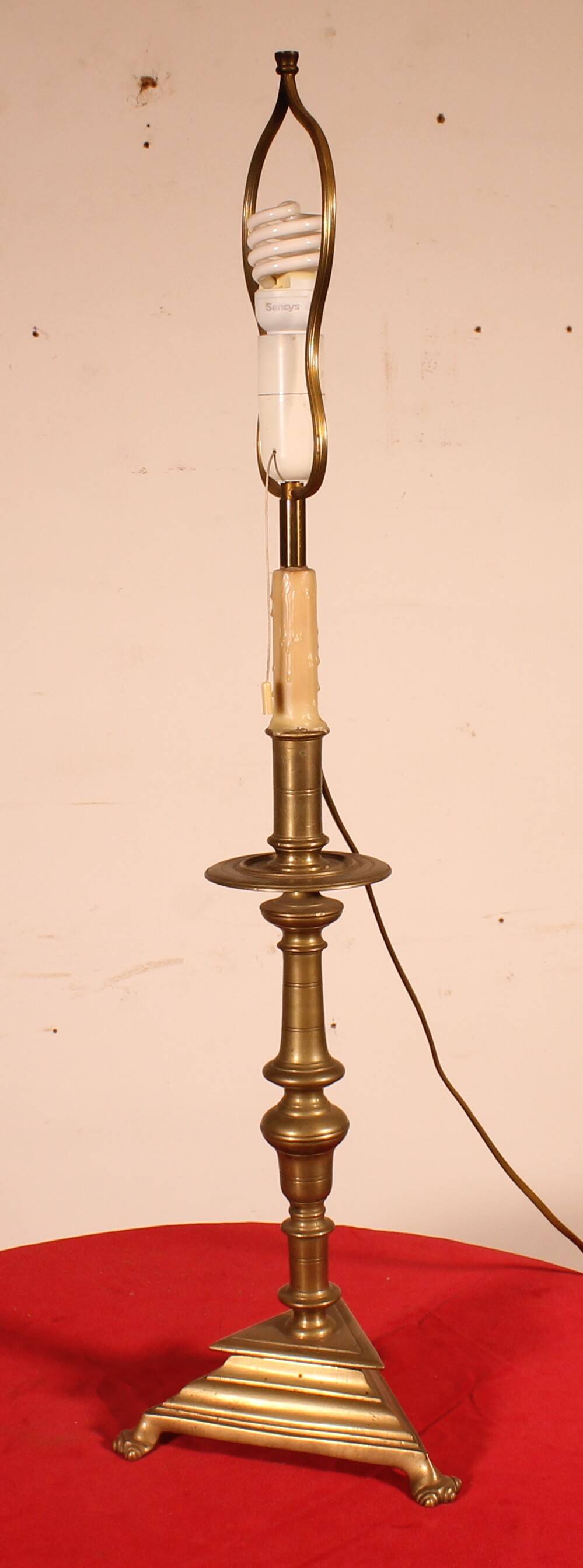 bronze candlestick from the 17th century converted into a lamp with its lampshade