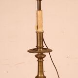 bronze candlestick from the 17th century converted into a lamp with its lampshade