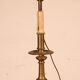 bronze candlestick from the 17th century converted into a lamp with its lampshade