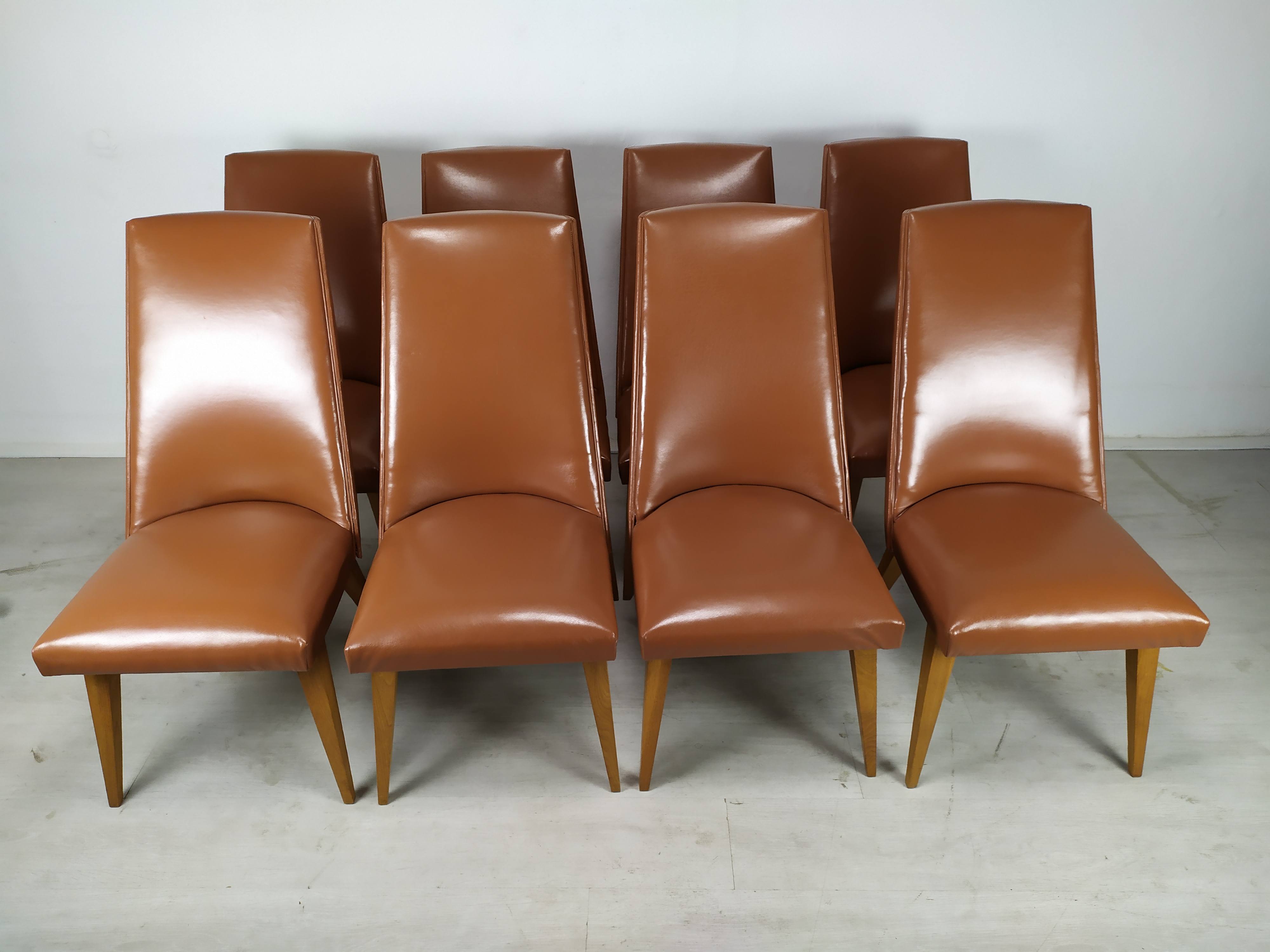 8 brown skai chairs 1950