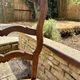 Antique Provençal armchair in wood with a straw seat.