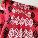 Vintage graphic red tablecloth and 8 matching napkins.