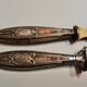 Paper cut with a stamp handle punches boar heads