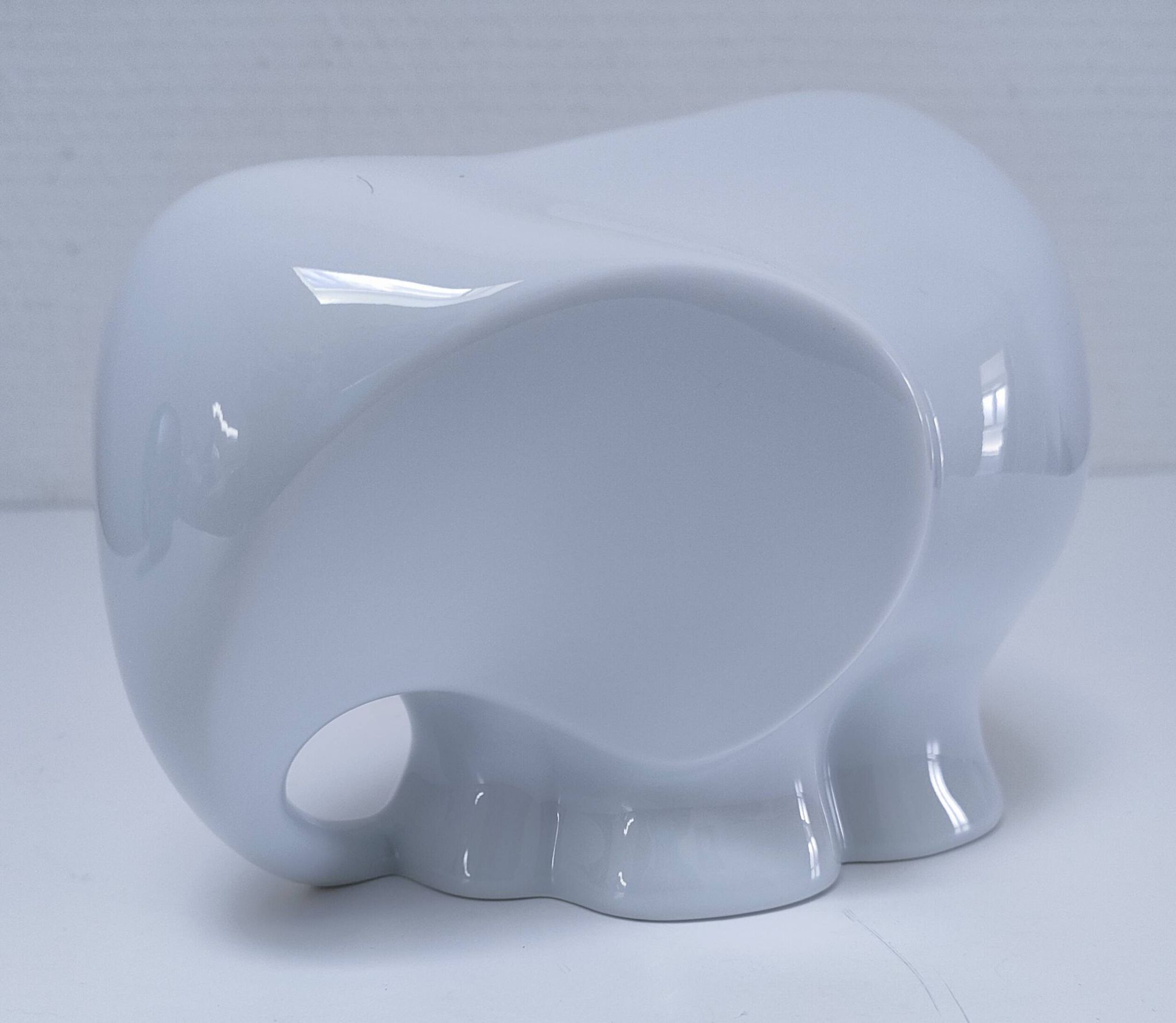 Two iridescent black and white ceramic elephants design
