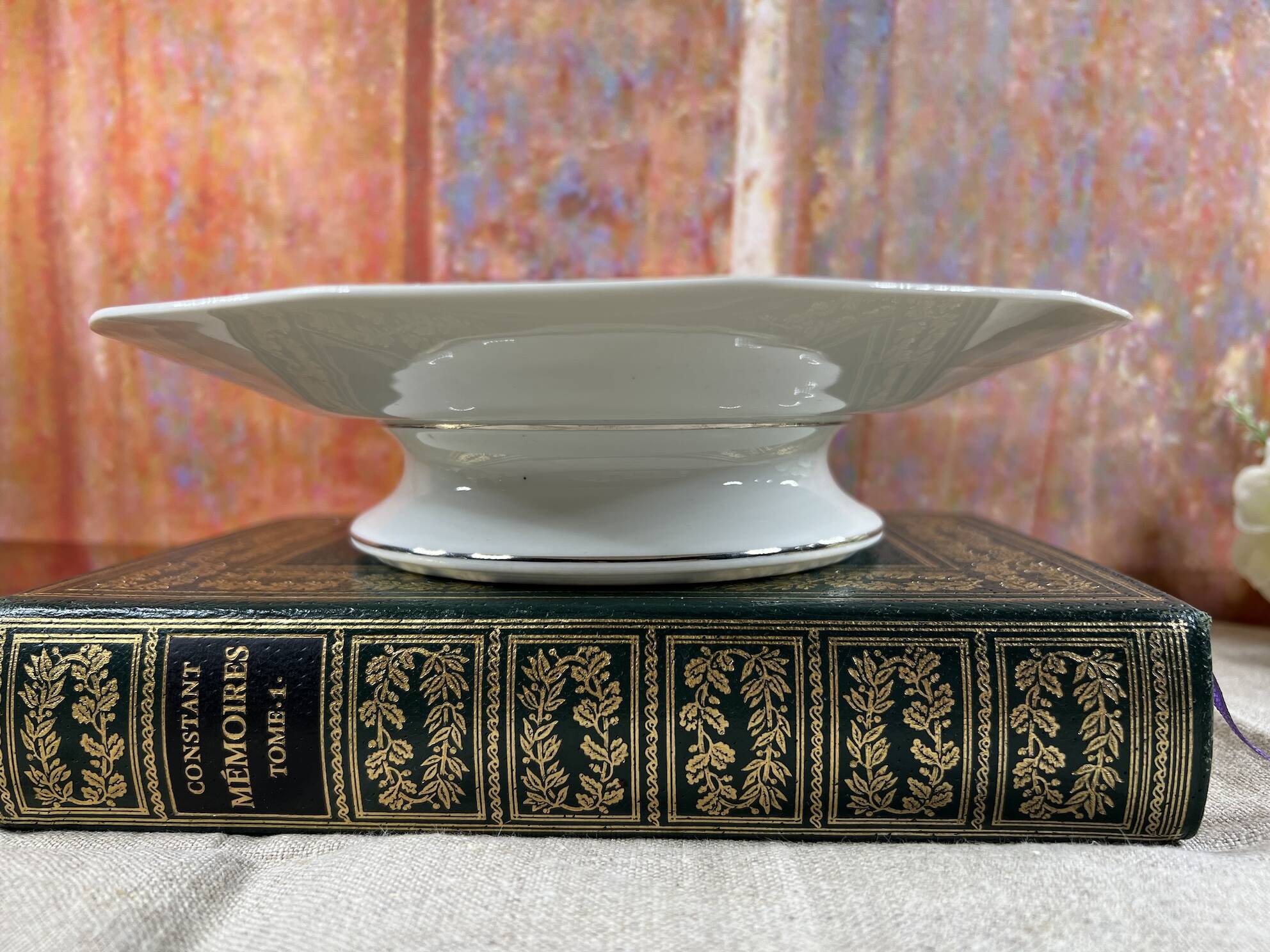 Cup on foot display in Limoges porcelain