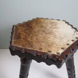 Vintage Spanish stool in carved wood with a leather seat.
