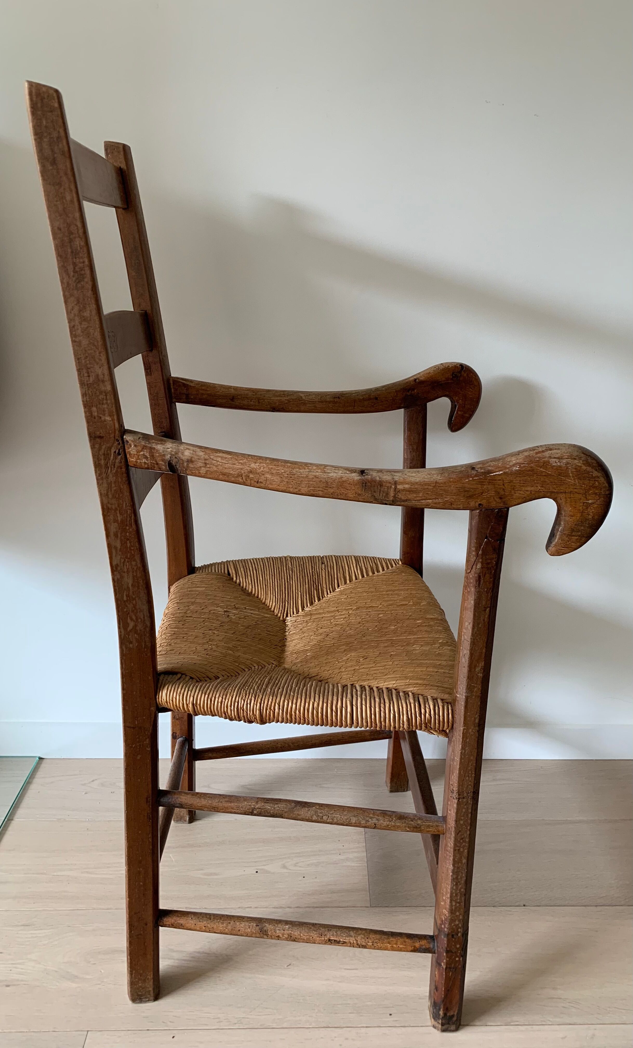 Antique wood and straw armchair
