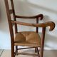 Antique wood and straw armchair