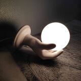 White ceramic hand sconce with white opaline globe