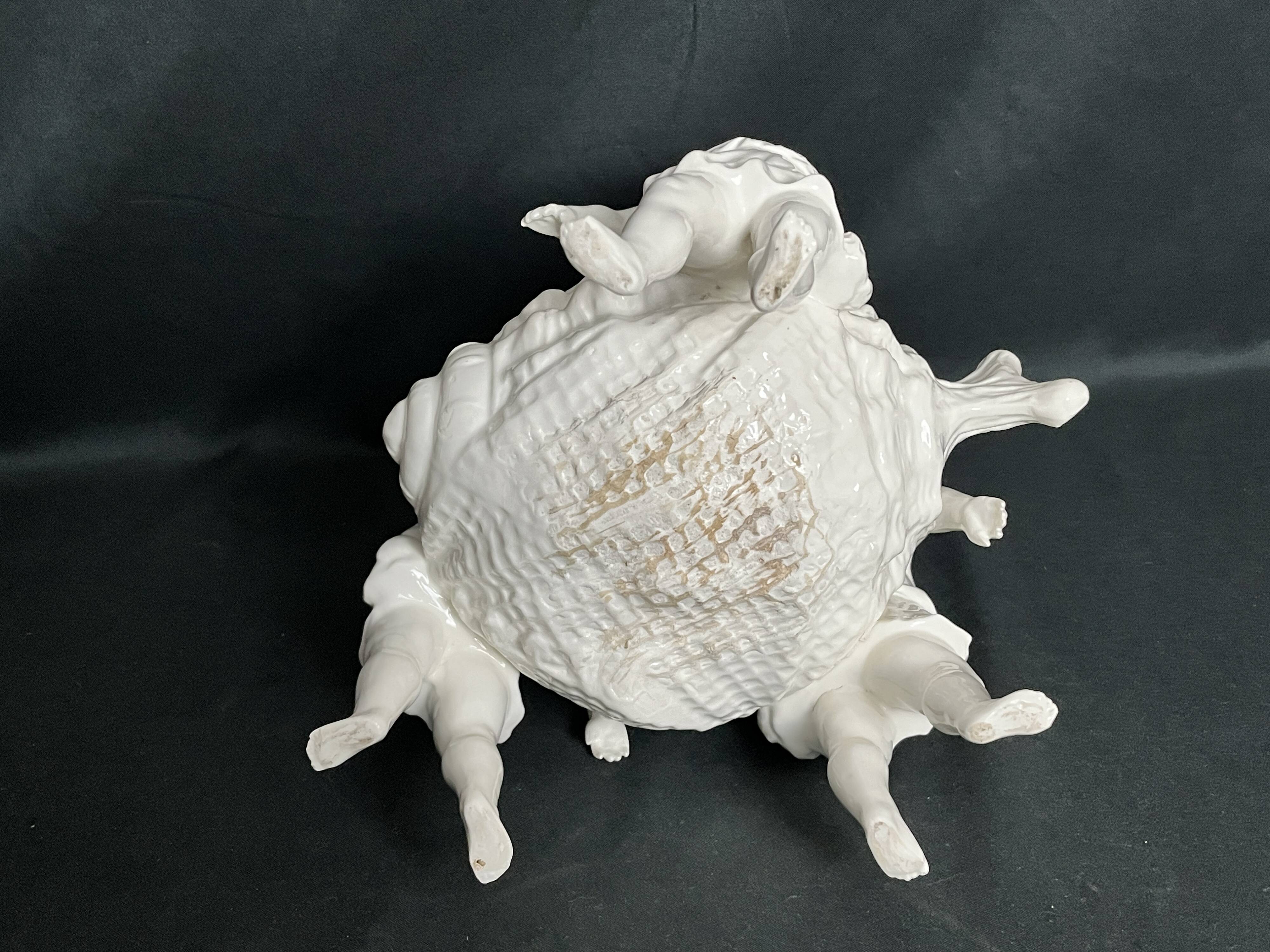 Porcelain, centerpiece with candle holder decorated with putti, 20th century