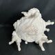 Porcelain, centerpiece with candle holder decorated with putti, 20th century