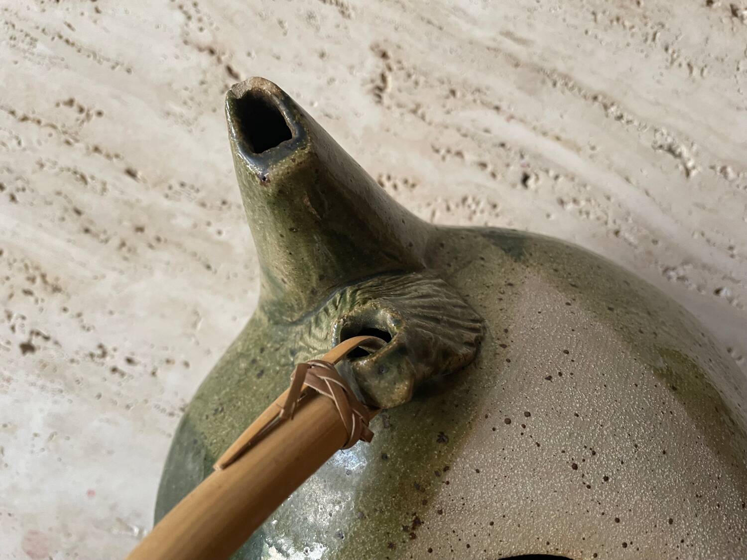 Handmade ceramic teapot with green fish and bamboo