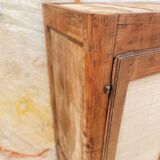 Low cabinet in raw wood and woven raffia