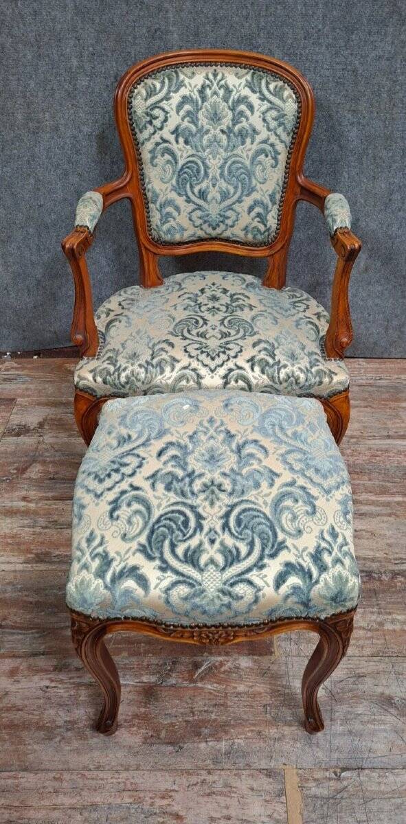 Cabriolet armchair in cherry wood with its footrest, 20th century.