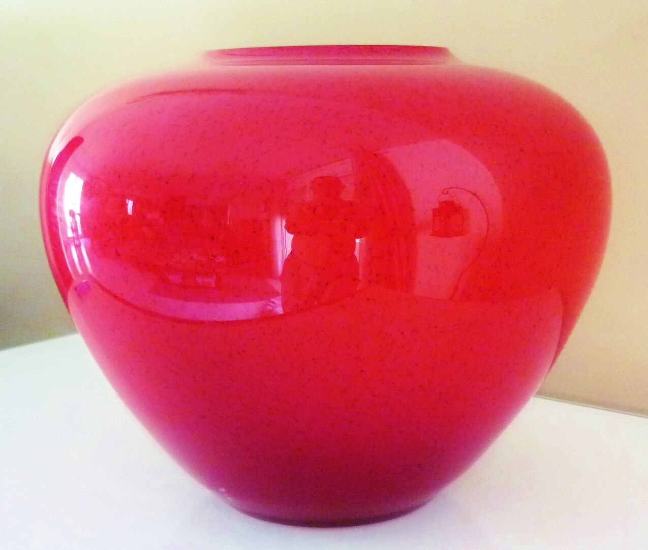 Pot-bellied, art deco vase in speckled ruby red multi-layered glass, white interior