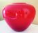 Pot-bellied, art deco vase in speckled ruby red multi-layered glass, white interior