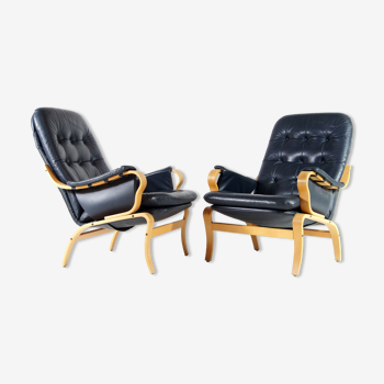 Pair of vintage leather lounge armchairs 70s
