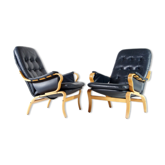 Pair of vintage leather lounge armchairs 70s