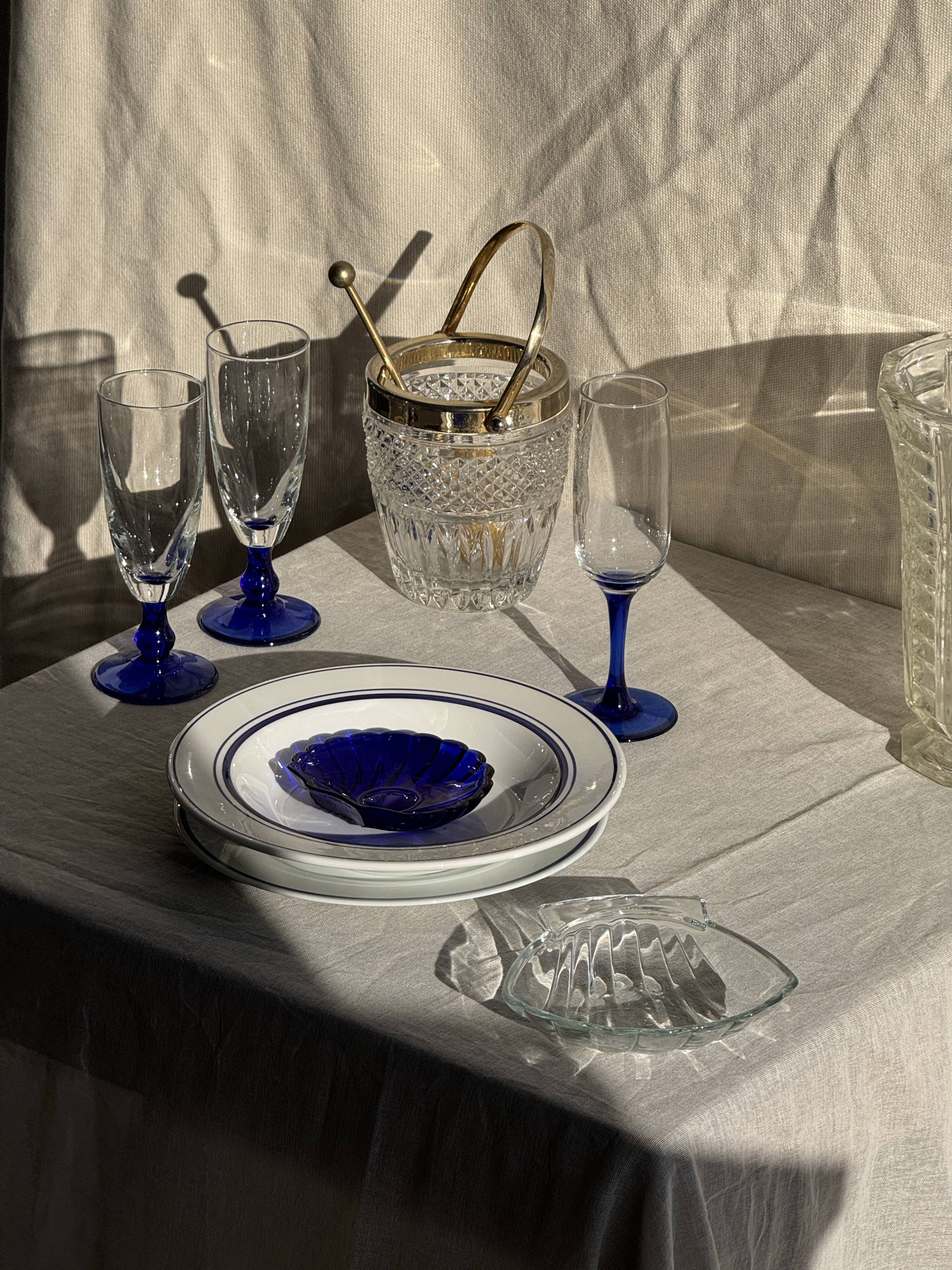 Small golden glass ice bucket with diamond point design and its scoop.