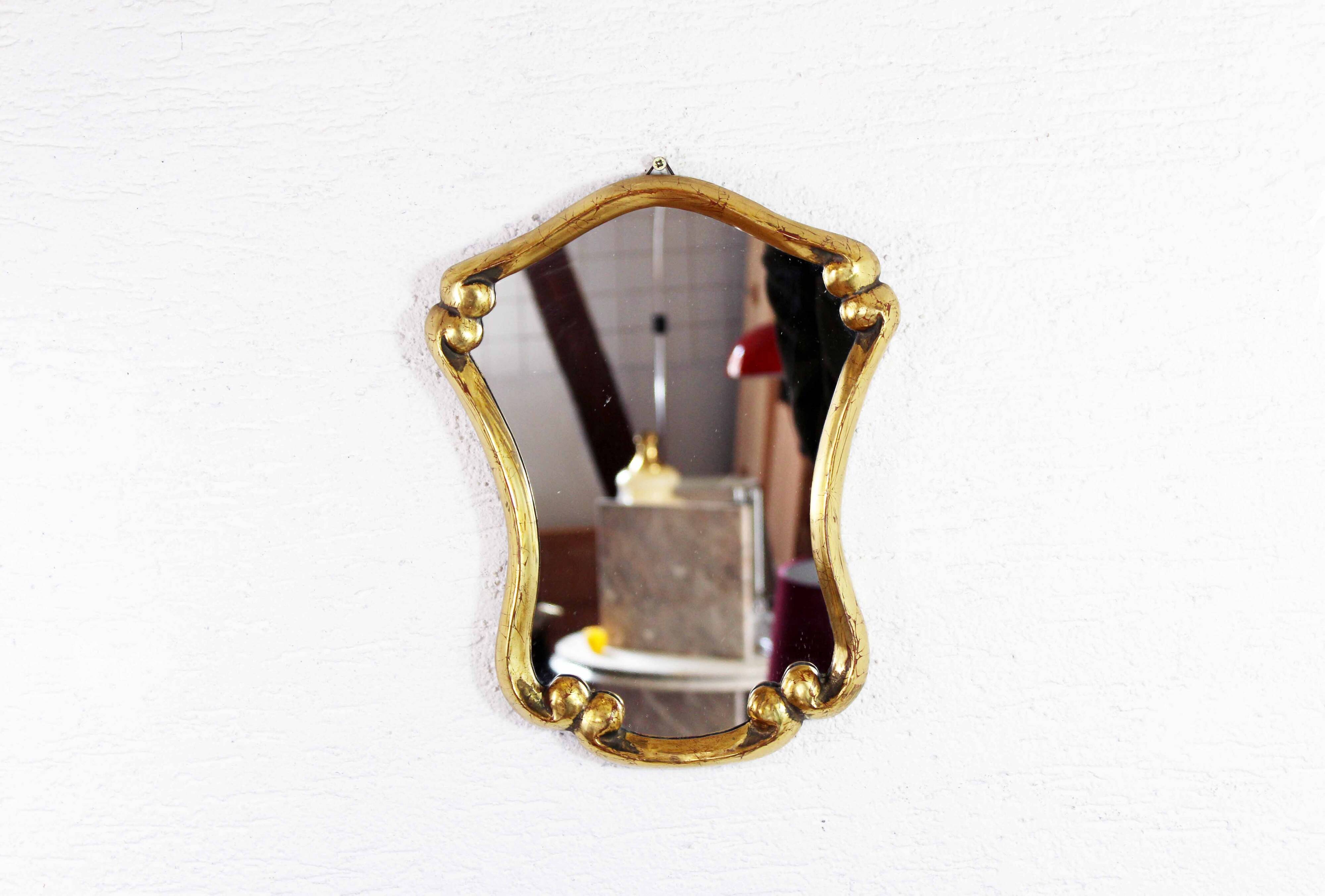 Mirror in gilded wood with leaf