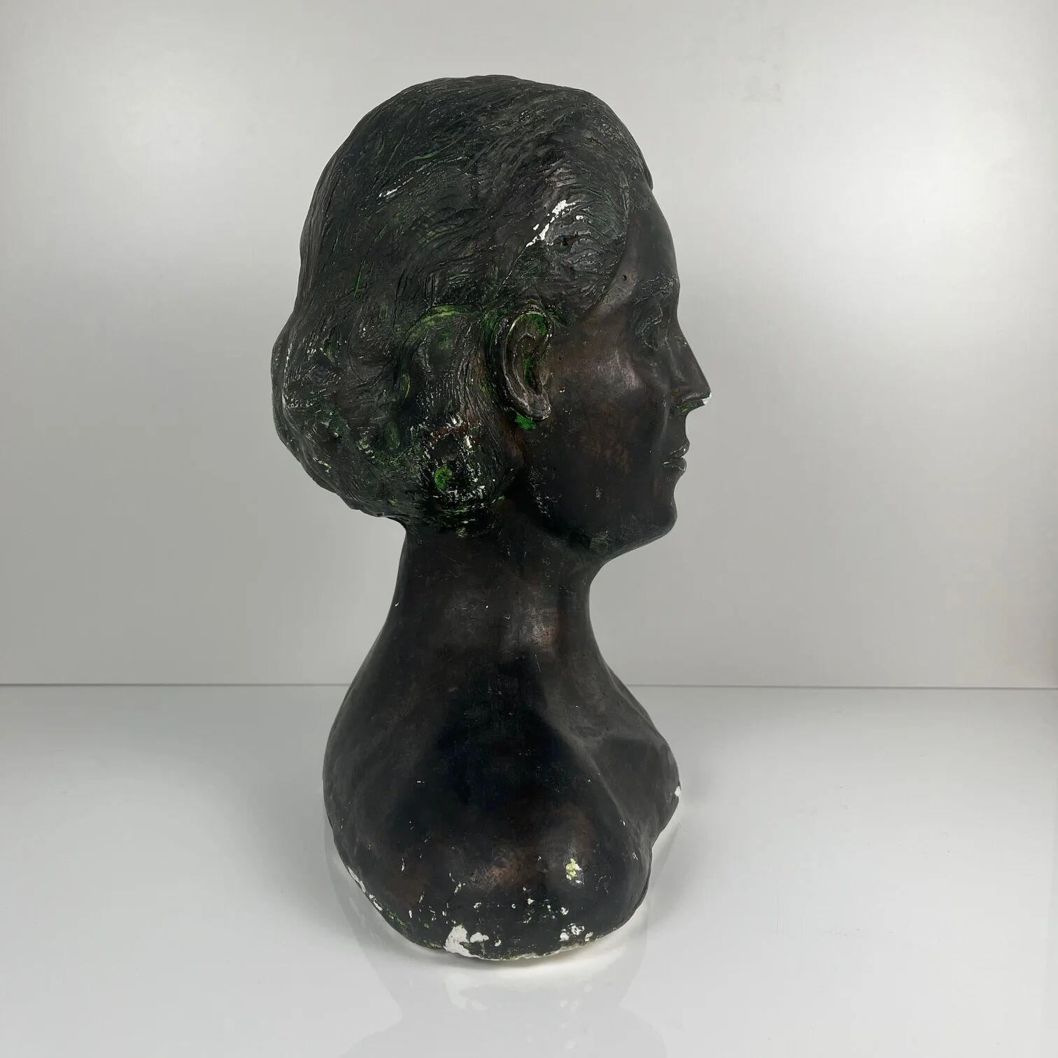 Female bust in neoclassical style in plaster by M. Mongey, 20th century.