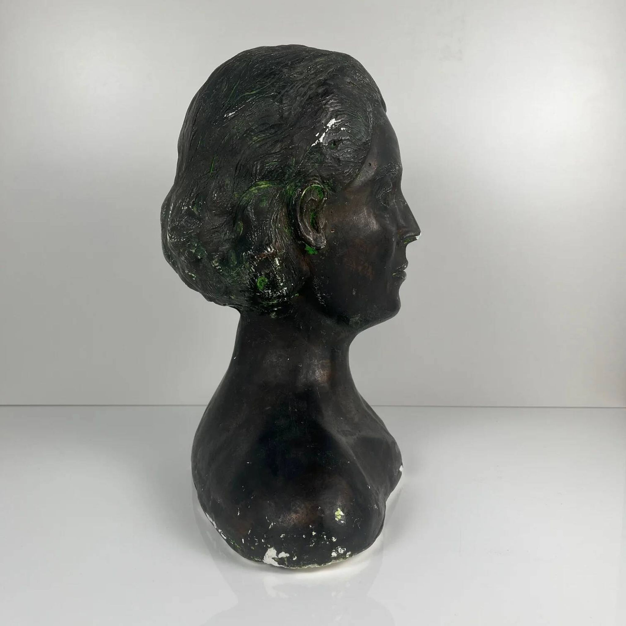 Female bust in neoclassical style in plaster by M. Mongey, 20th century.