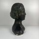 Female bust in neoclassical style in plaster by M. Mongey, 20th century.