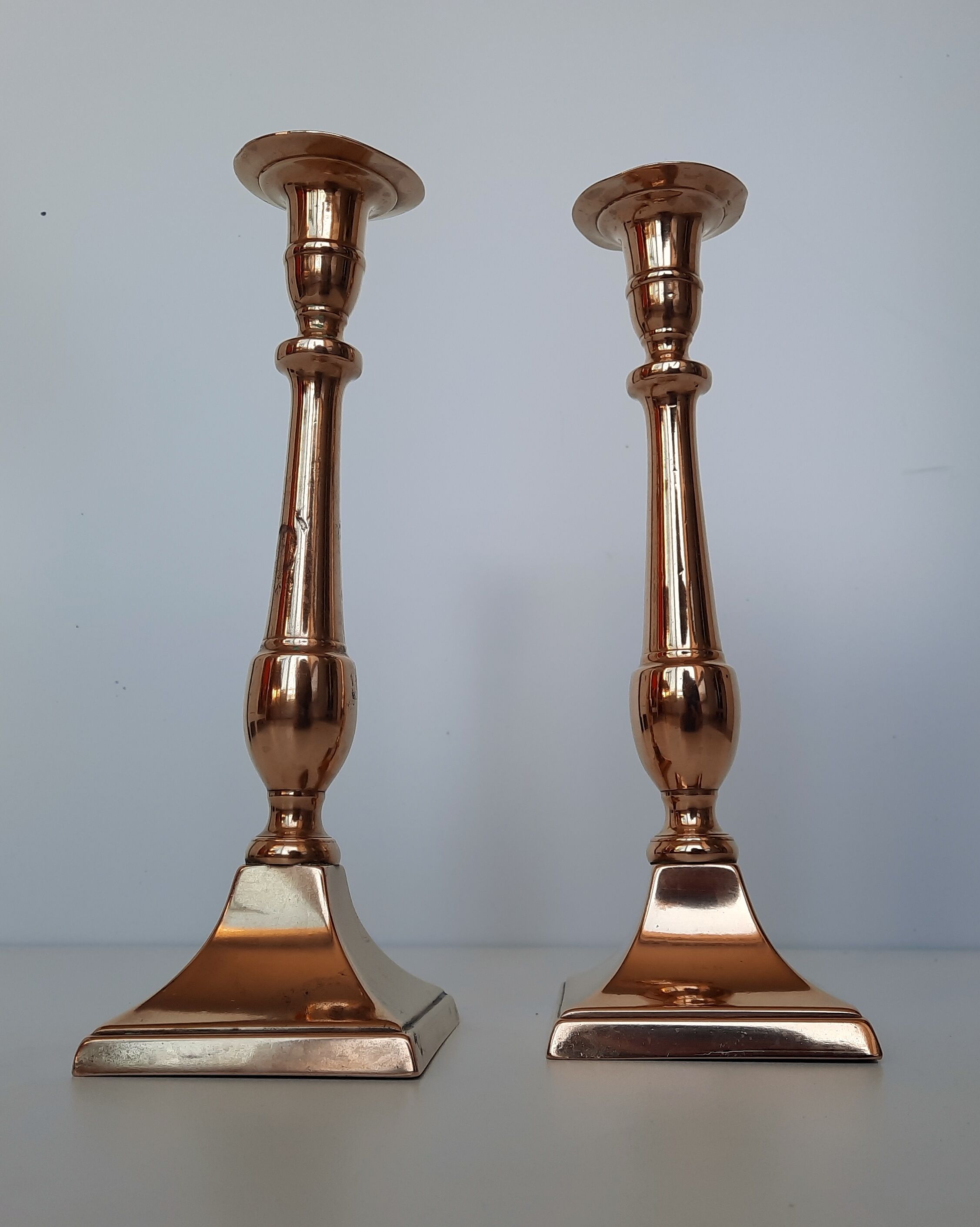 Pair of square foot copper candle holders