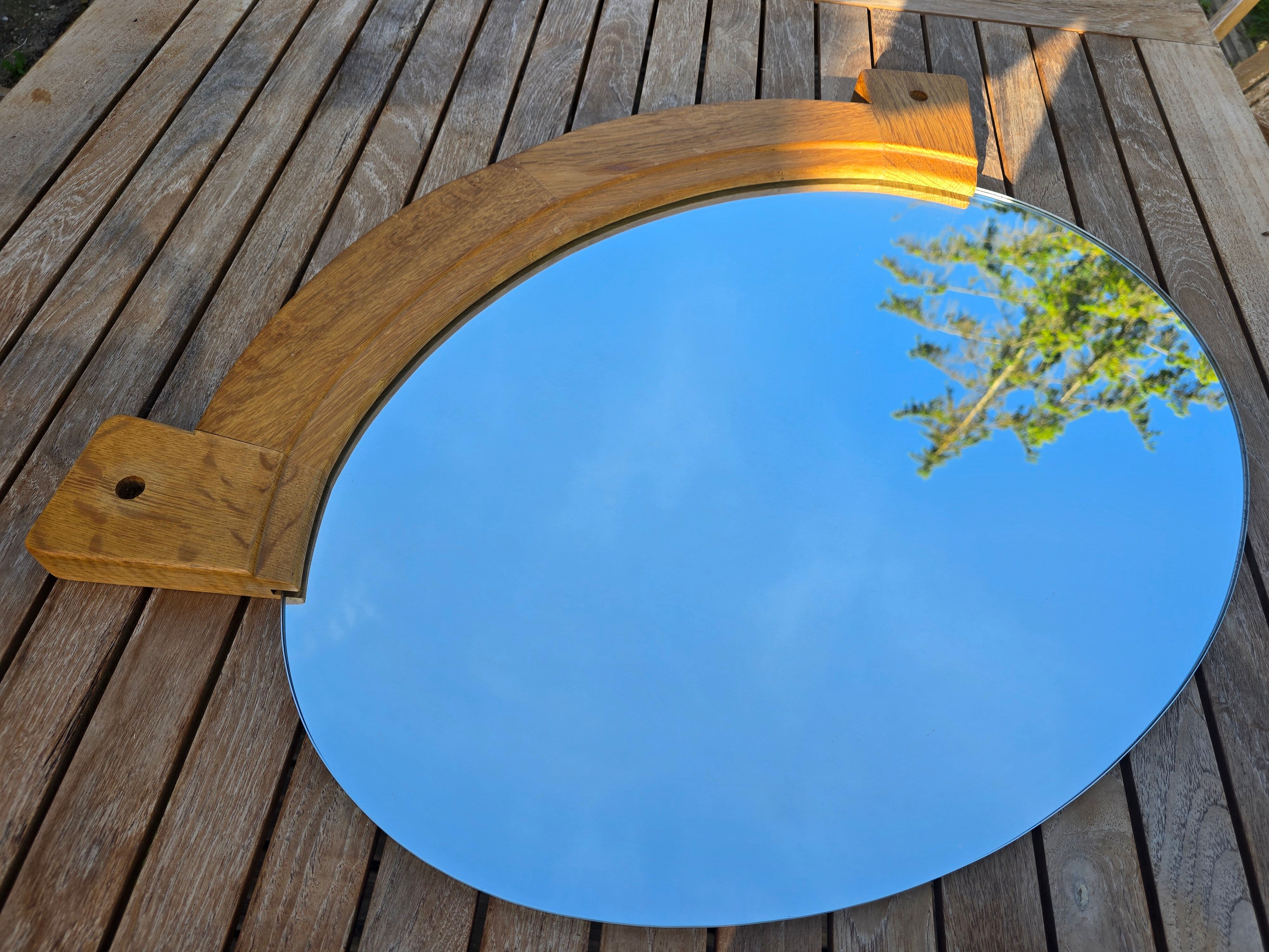 Oval mirror by Guillerme and Chambron