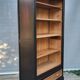 Two-tone black and honey bookcase