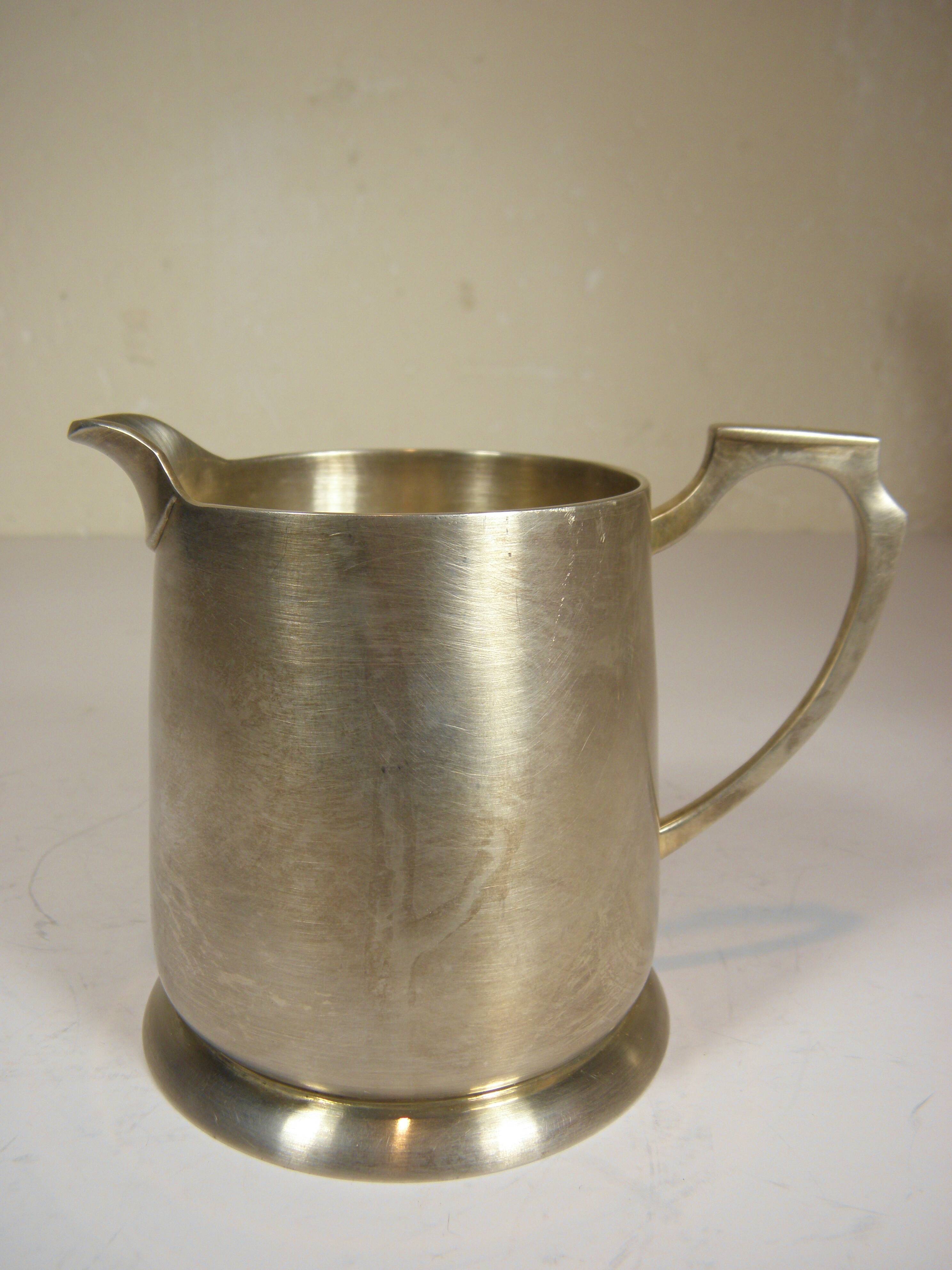 Silver-plated metal coffee pot and milk jug