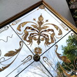 Glass mirror with a decoration engraved with golden foliage 1960