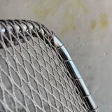 Pair of vintage silver aluminum wire folding chairs with wooden armrests — industrial minimalist