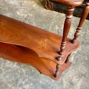 Curved and turned wooden wall shelf