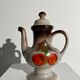 Vintage stoneware teapot with flower and fruit patterns