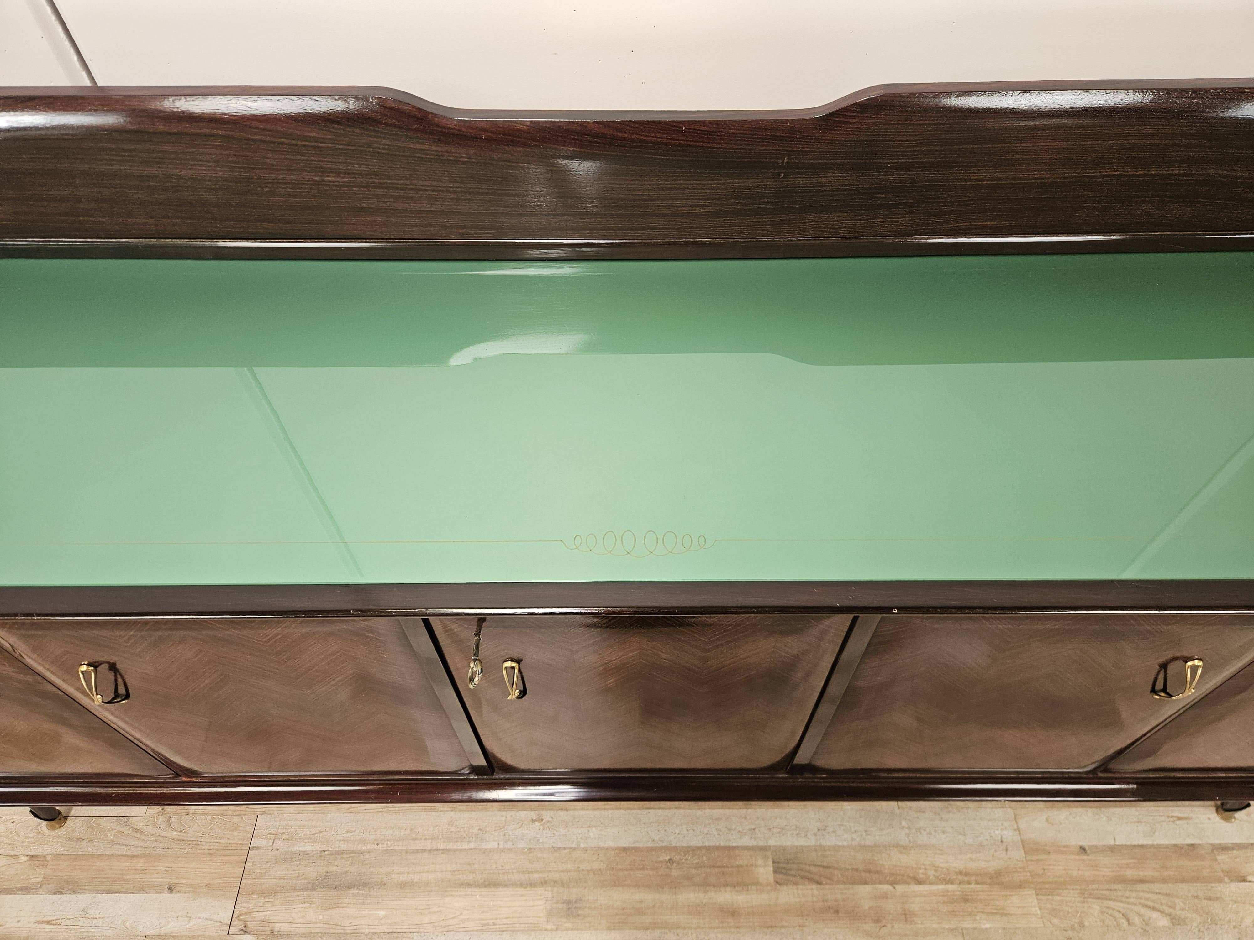 Mahogany sideboard with a glass top, 1960