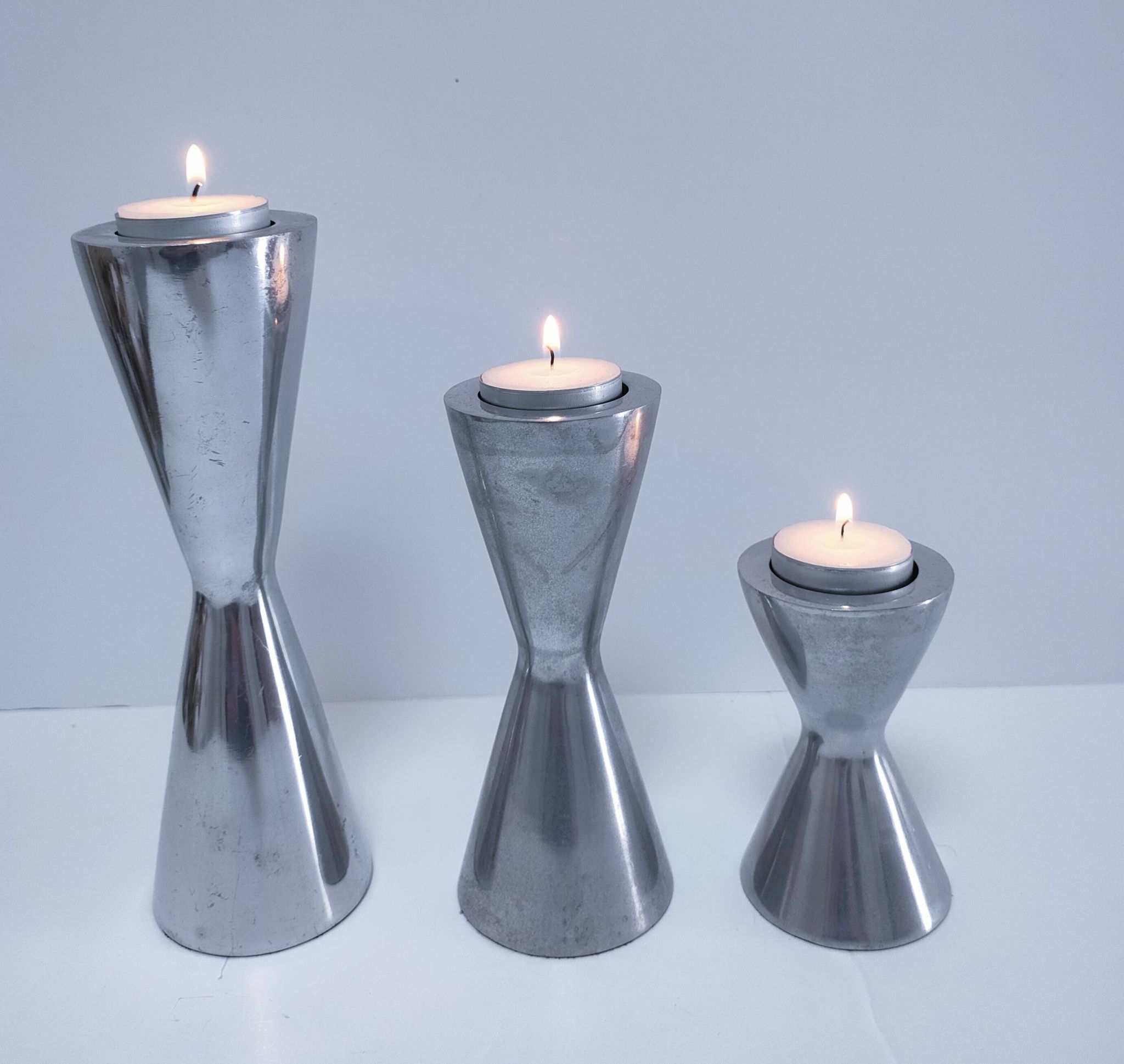 three "diabolo" aluminium design candle holders 90