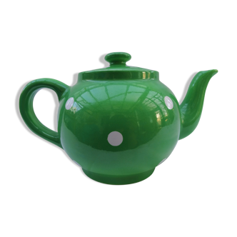 Green earthenware teapot with white polka dots