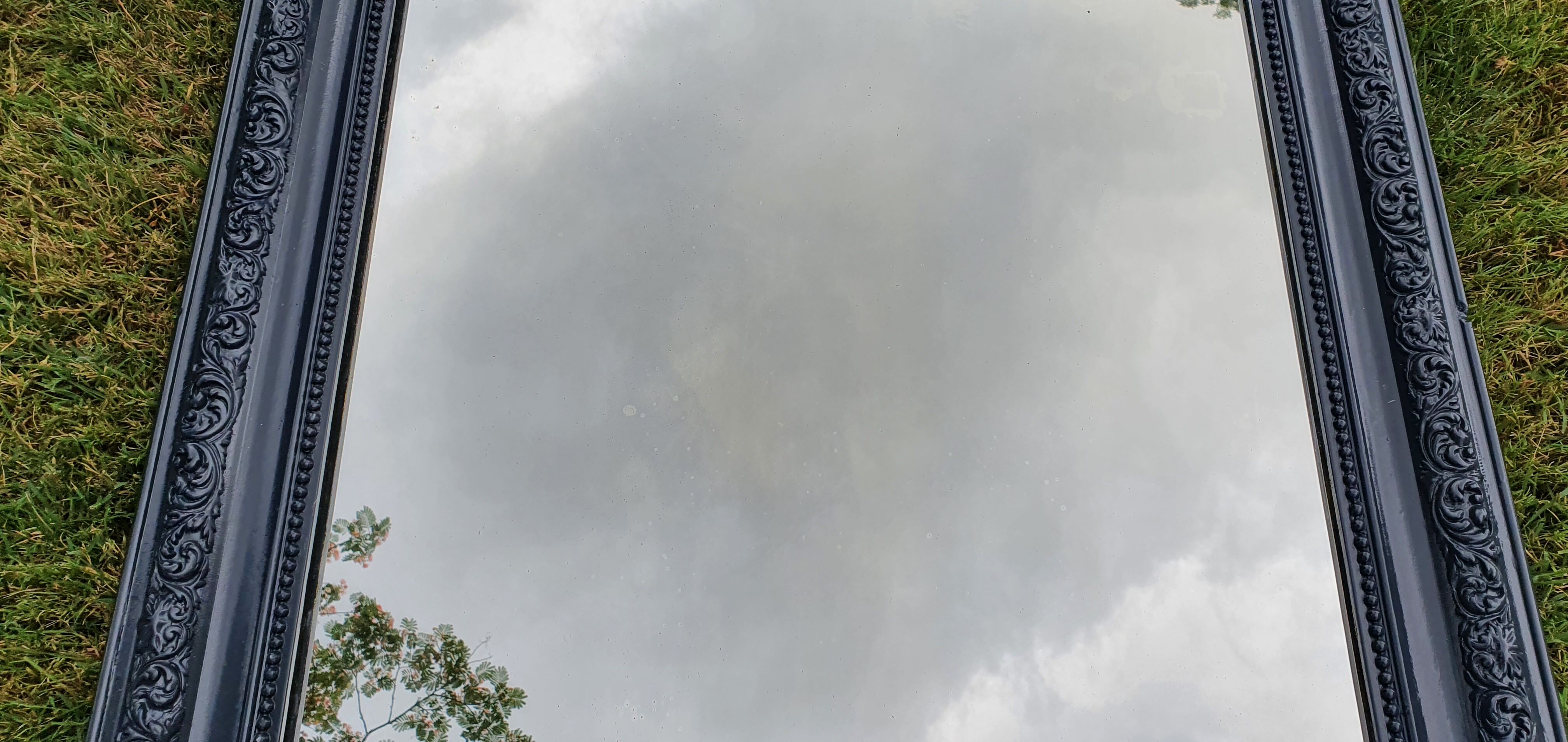 Old mirror Louis Philippe anthracite gray with pricked ice.