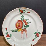 Easternth century earthenware plate, ribboned floral decoration
