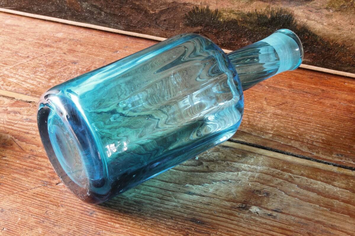 Large blown crystal bottle, twisted, turquoise blue, early 20th century.