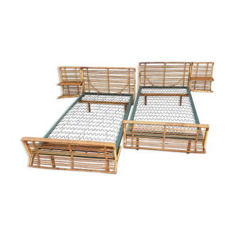 Twin rattan beds with built-in bedside tables