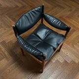 Chair with armrests by Kristian Solmer Vedel