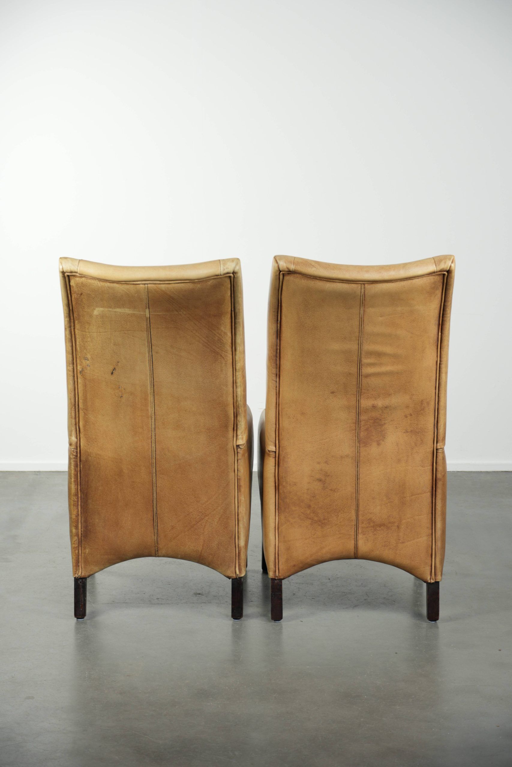 Set of six cowhide dining chairs with a comfortable seat and high back