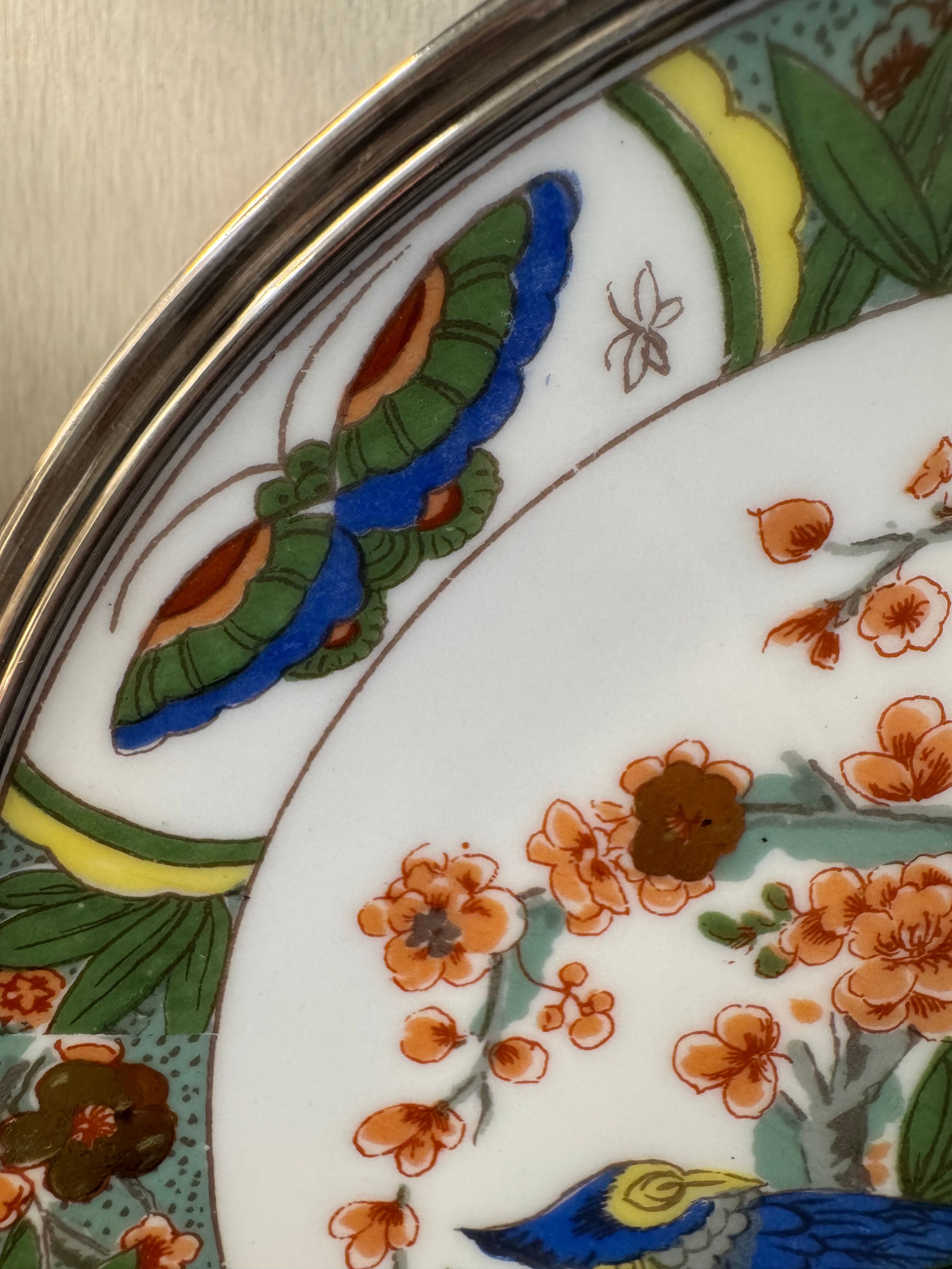 Two Raynaud Limoges plates and Tetard brothers silver.