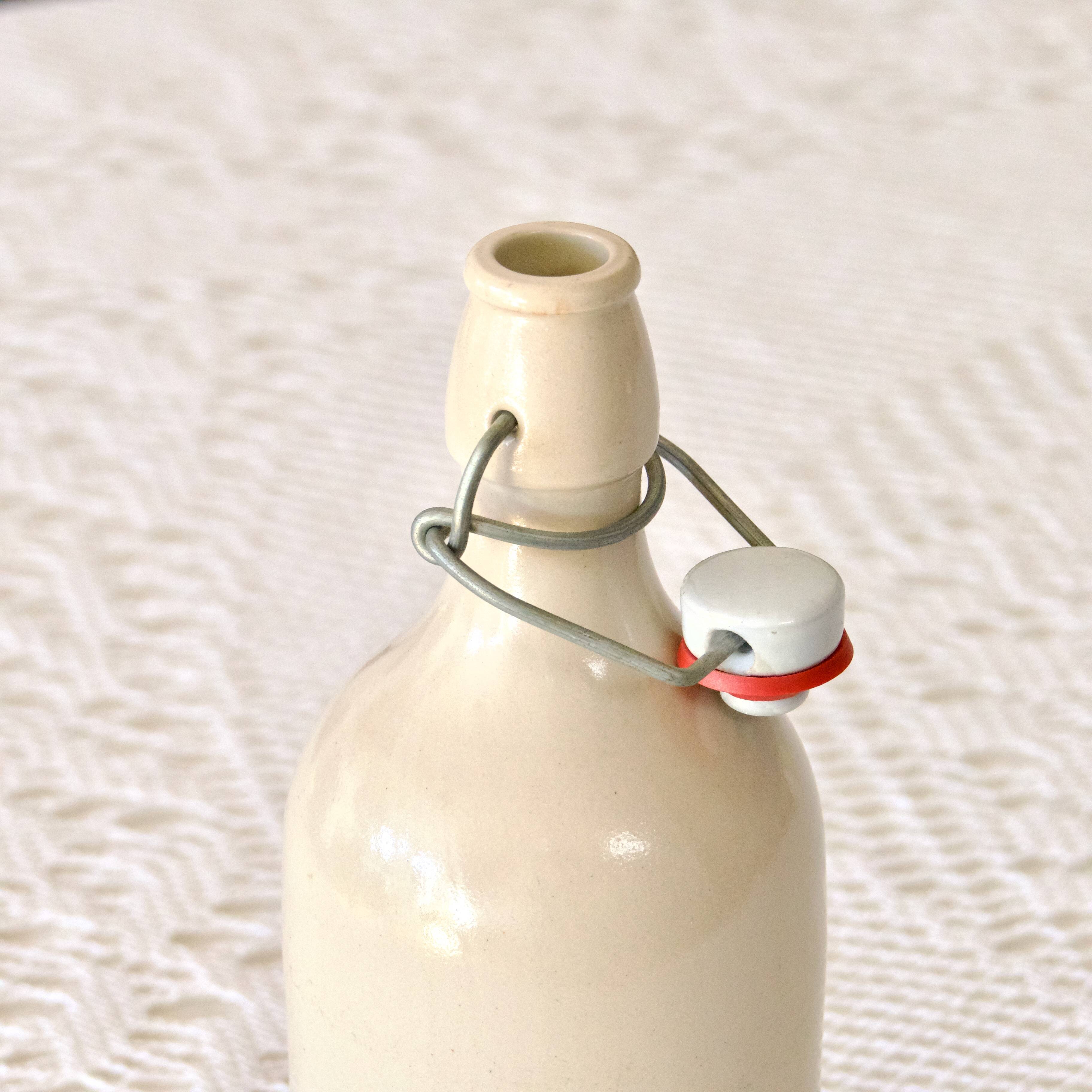 Antique enamelled stoneware beer bottle signed MKM